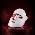 Masque LED Éclatra luminothérapie visage 7 couleurs fond bordeaux
